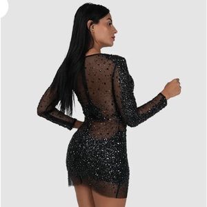 Sexy black dress with beaded embellishments.